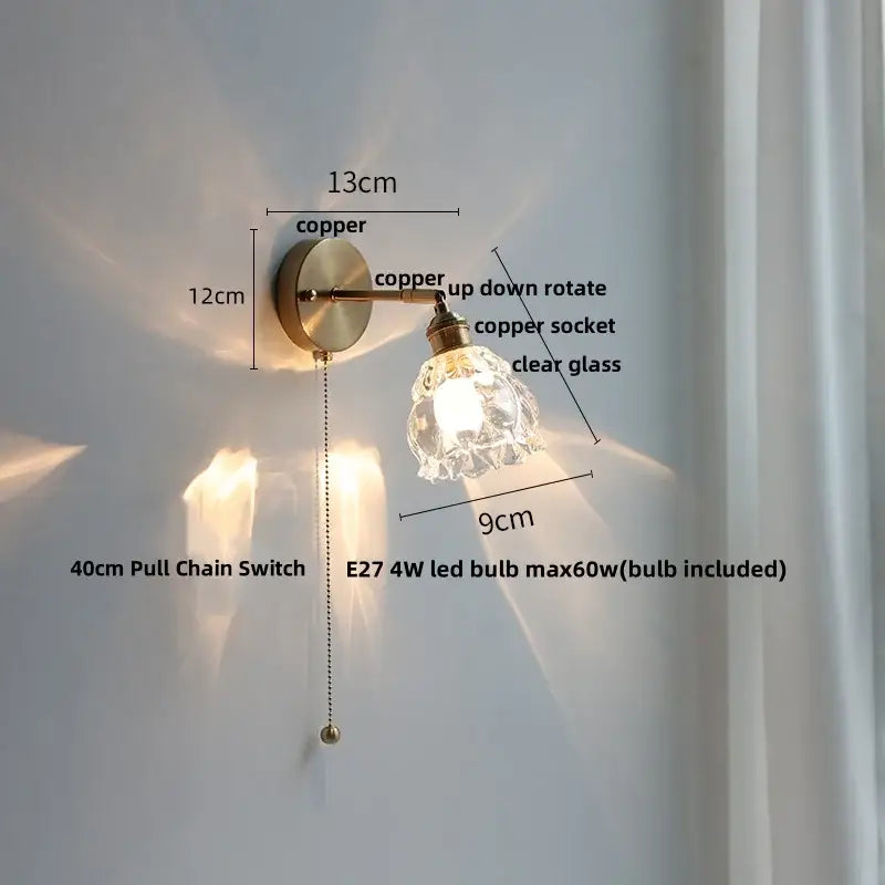 Modern brass floral wall sconce with copper finish clear glass shade and adjustable arm by decorbites clear glass