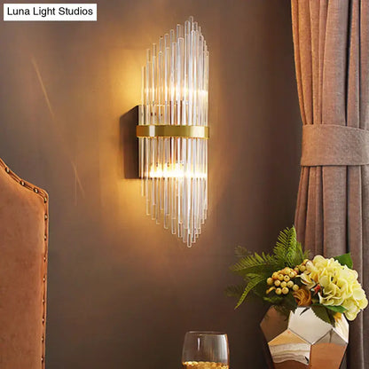 Modern brass wall sconce with fluted glass shade and polished gold frame direct wired electric bedroom light