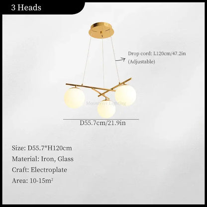 Modern brass french glass ball pendant light features a gold electroplated iron frame with three spherical shades decorbites french glass
