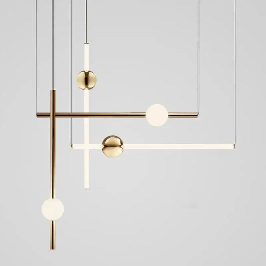 Modern brass geometric glass pendant lights featuring spherical glass orbs and minimalist rods for dining room use