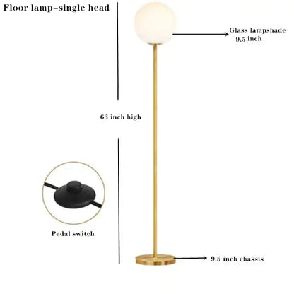 Modern brass floor lamp with gold finish glass ball lampshade and circular base ideal for bedroom and study decorbites glass ball