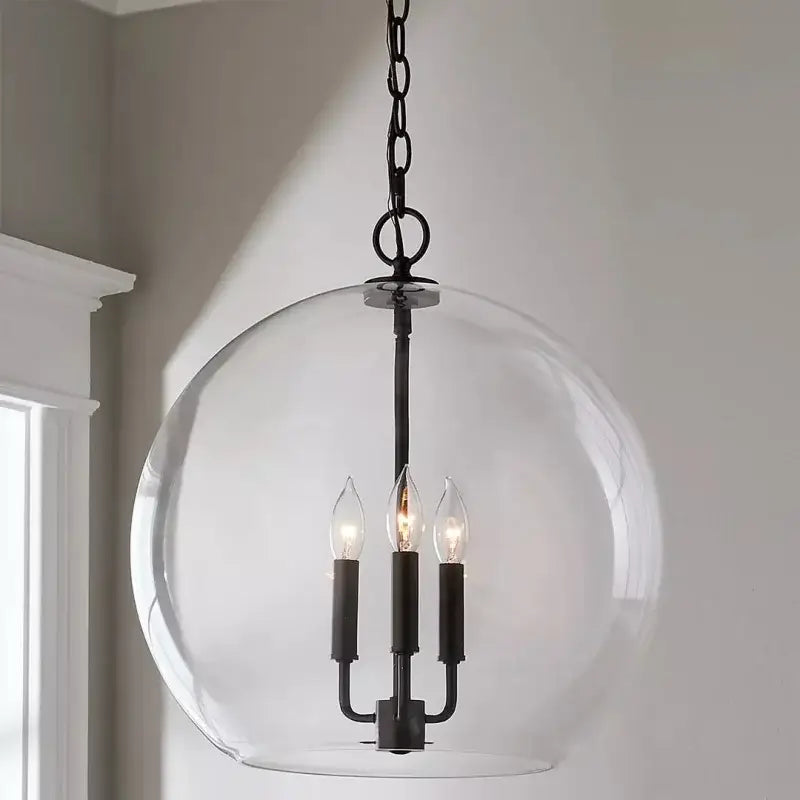 Modern brass glass ball led chandelier with black metal frame and clear glass globe for dining room decorbites glass ball