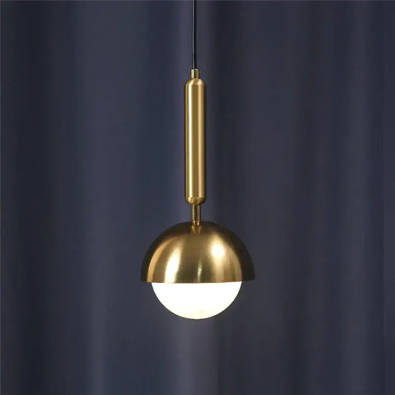A modern brass glass ball led pendant chandelier with a polished stem and dome shade for dining room decorbites decor