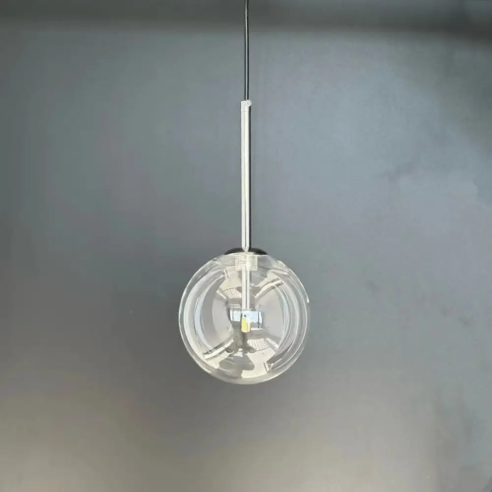 Modern brass glass ball led pendant lamp featuring a clear glass ball led with a sleek chrome-finished rod for decorbites glass ball lighting