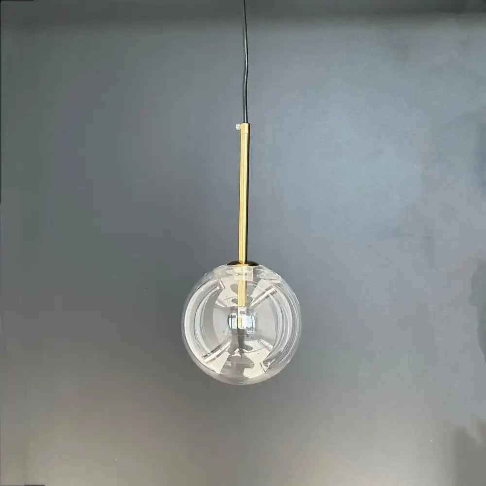 Modern brass glass ball led pendant lamp with clear glass globe and gold-toned rod for living room decorbites glass ball lighting