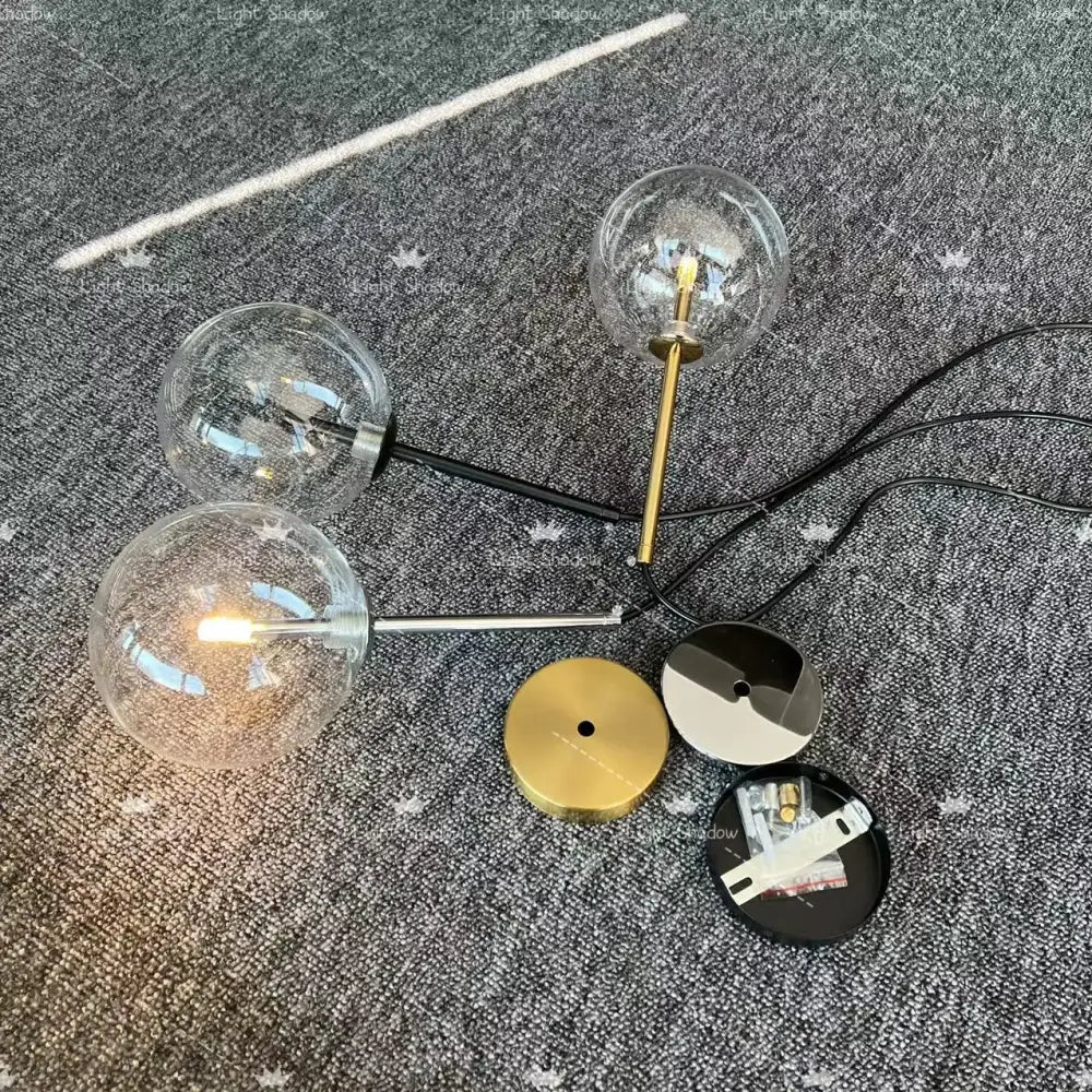 Modern brass glass ball led pendant lamp with three clear textured glass globes and black gold chrome finishes