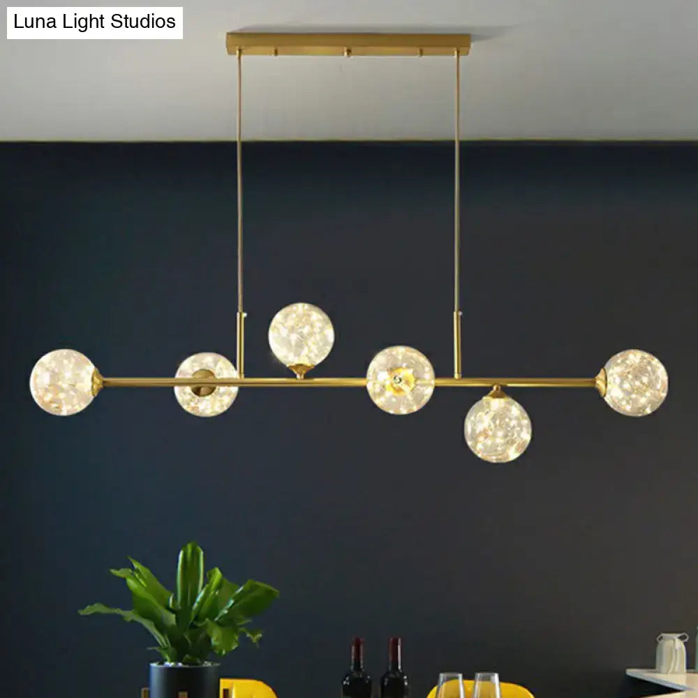 DecorBites™ 6-light linear dining room pendant with gold-toned finish and smoke gray glass ball shades