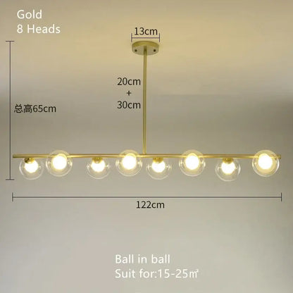 Modern brass glass ball pendant chandelier with eight clear glass globe bulbs in a linear design for dining room decorbites glass ball pendant