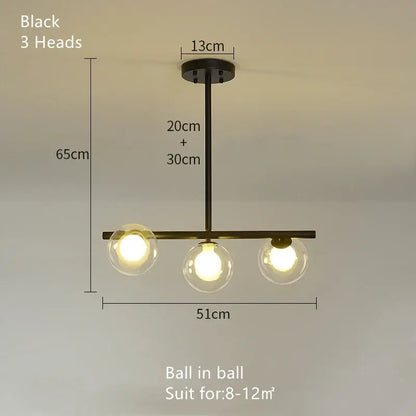 Modern brass glass ball pendant chandelier with black metal frame and clear glass globe bulbs for dining room decorbites glass ball