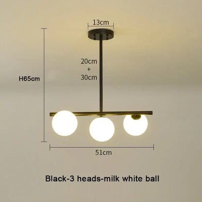 Modern brass glass ball pendant chandelier with black finish and three milk-white glass ball pendant bulbs for dining room decorbites