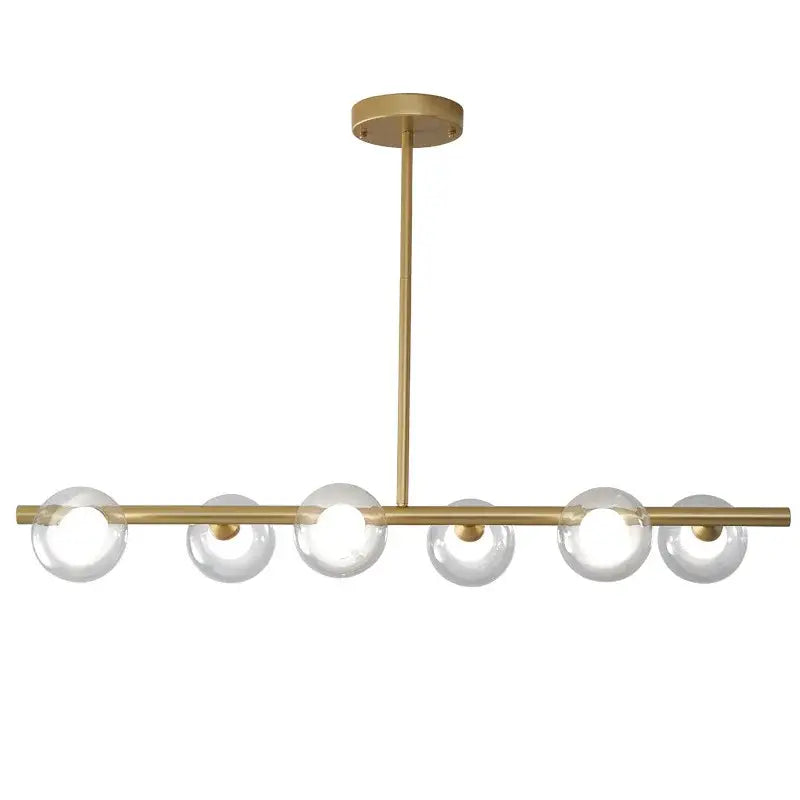 Modern brass glass ball pendant chandelier with six clear glass globe bulbs in a linear design for dining room decorbites glass ball