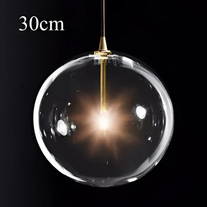 Modern brass glass ball pendant light with 30cm spherical glass shade and brass-finished fixture for kitchen decorbites pendant light
