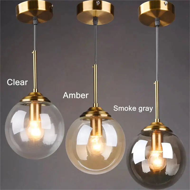 Three modern brass glass ball pendant lights with clear amber and smoke gray shades for dining room decorbites glass ball pendant