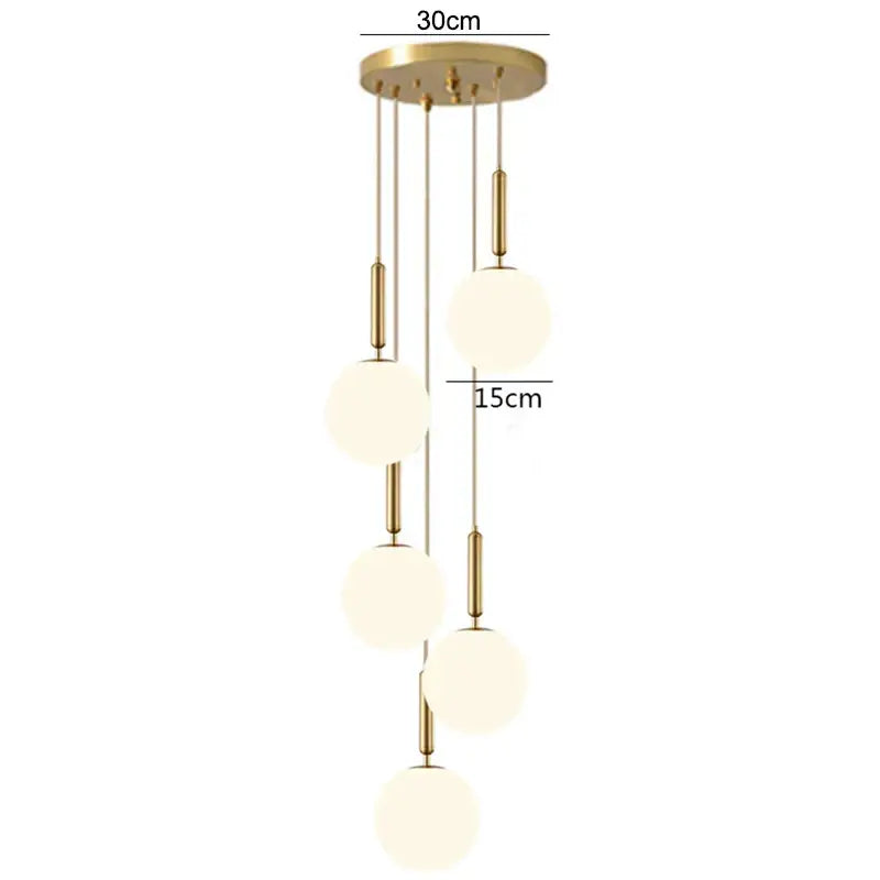 Modern brass glass ball pendant lights with five frosted glass spheres and gold-toned rods for kitchen decorbites decor