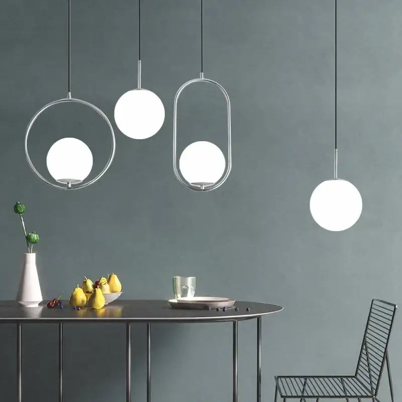 Modern brass glass ball pendant lights with sleek chrome frames and frosted glass globes for kitchen decorbites glass ball