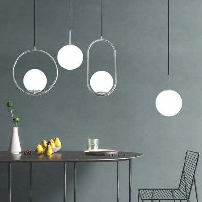 Modern brass glass ball pendant lights with sleek chrome frames and frosted glass globes for kitchen decorbites glass ball