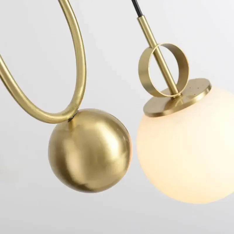 Modern brass glass ball pulley pendant light with brass finish and frosted glass globe for dining room decorbites pendant light