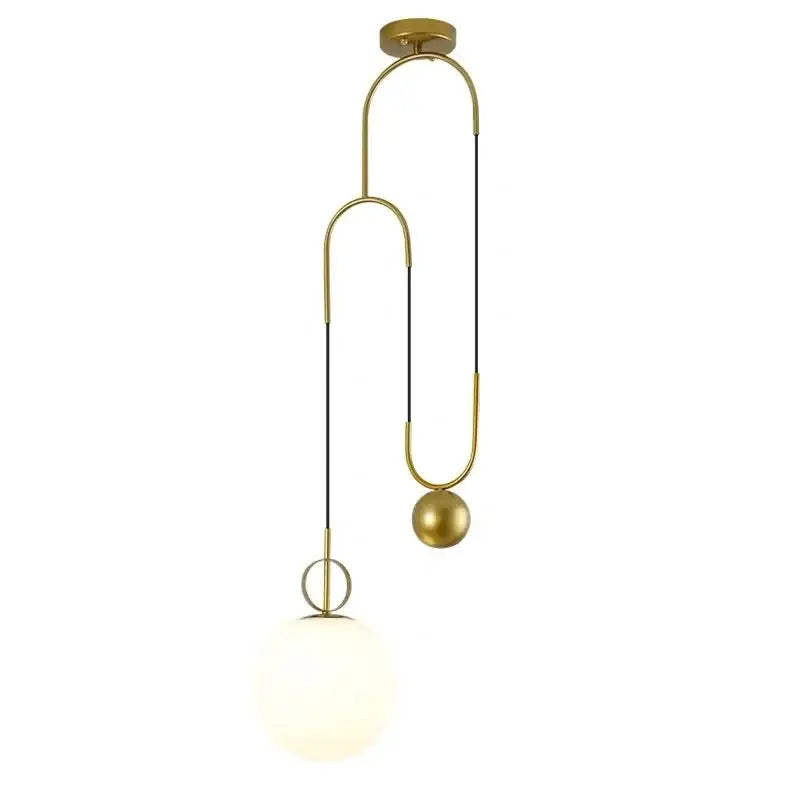 Modern brass glass ball pulley pendant light with gold-toned curved metal frame and opaque white glass globe shade for dining room decorbites pendant light