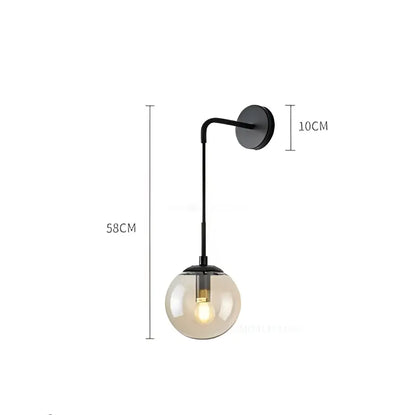 Black metal wall lamp with smoked glass globe featuring decorbites glass ball design for modern bedroom lighting