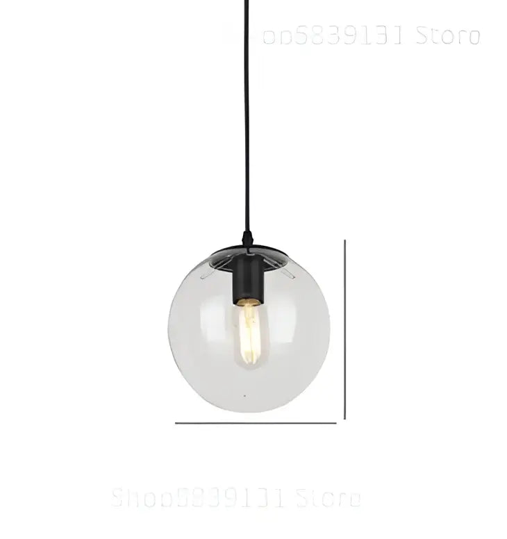 Modern brass glass ball wall lamps featuring a clear glass globe pendant light with black metal fixture and exposed bulb