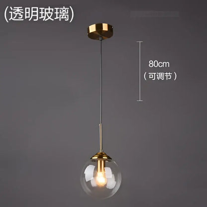 Modern brass glass ball wall lamps with gold-toned pendant light, clear glass globe, and adjustable 80cm chain for decorbites glass ball