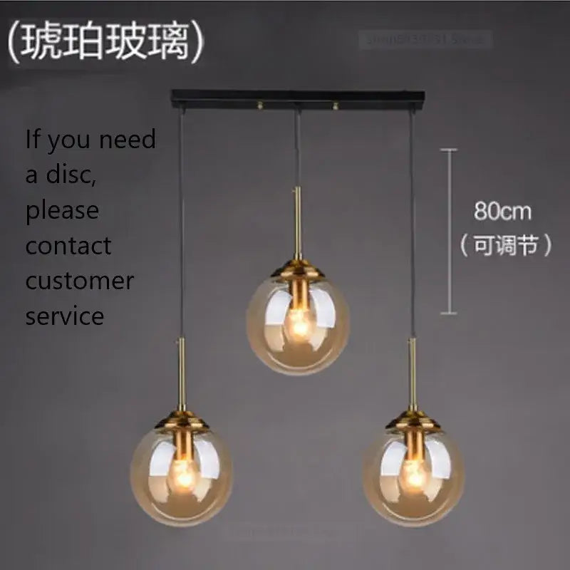 Modern brass glass ball wall lamps featuring three smoked glass globes and brass-finished metal fixtures for decorbites glass ball decor