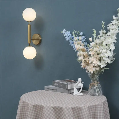 Modern brass glass ball wall lamps with two frosted glass spherical shades for bedroom lighting decorbites wall lamps