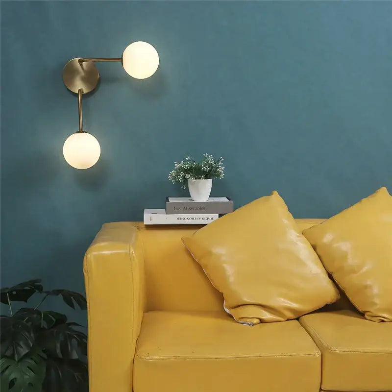 Modern brass glass ball wall lamps with two frosted glass shades for bedroom lighting by decorbites wall lamps
