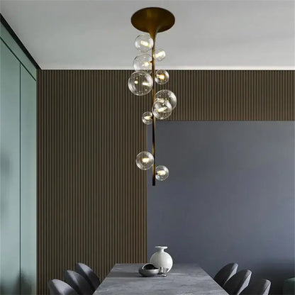 Modern brass glass bubble pendant light with clear glass spheres cascading for dining room decorbites pendant light