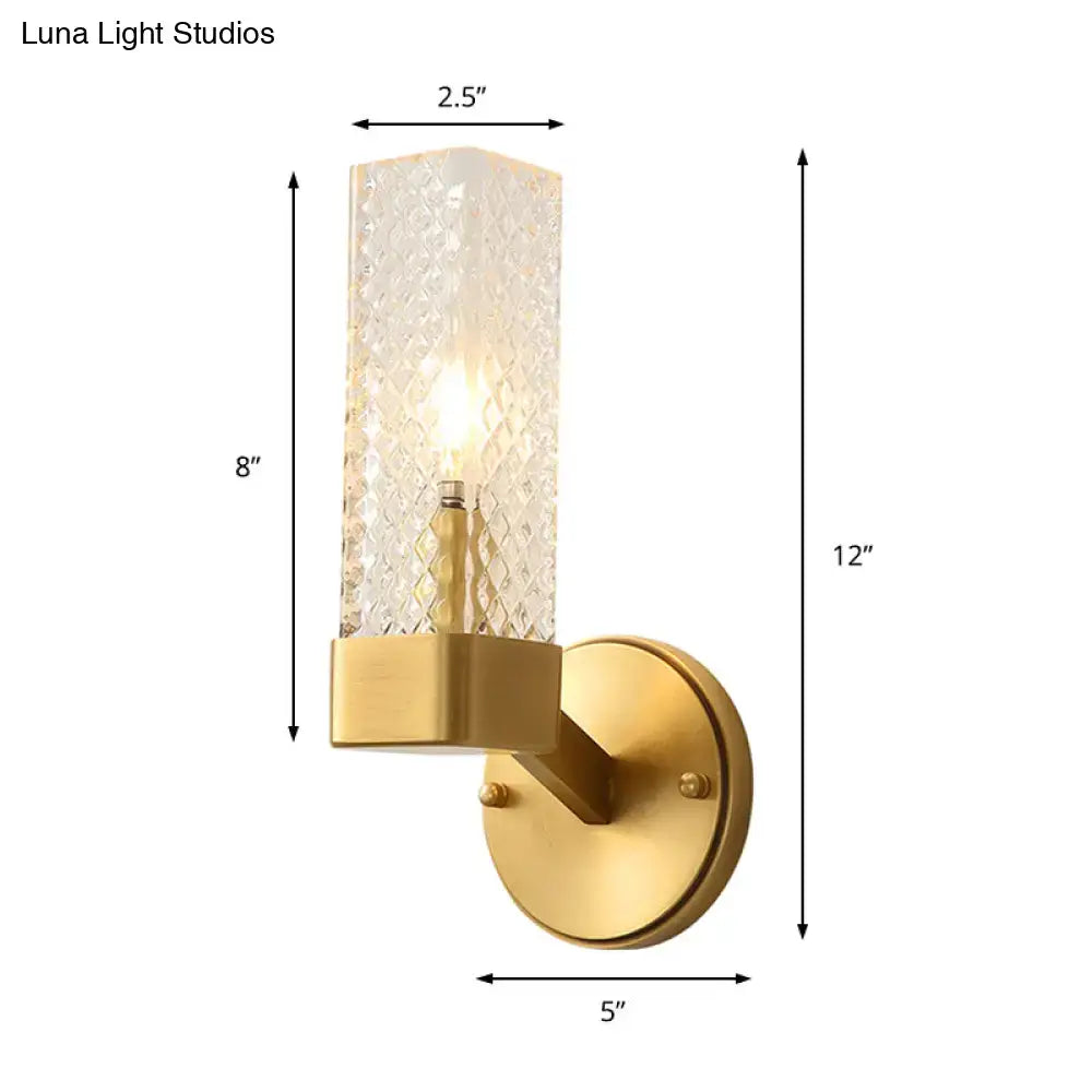 Modern brass glass cubic wall lamp with gold finish and diamond-cut textured glass cylinder for living room use
