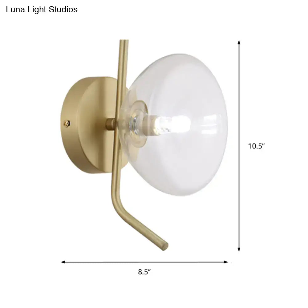 Modern brass glass dome wall sconce with gold arm and frosted glass dome for elegant bedroom lighting