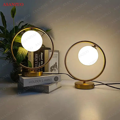 Modern brass glass led table lamp with gold finish and frosted glass globe bulbs for bedroom reading decorbites brass glass