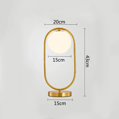 Modern brass glass led table lamp with gold-toned oval design and warm light for bedroom reading decorbites brass glass
