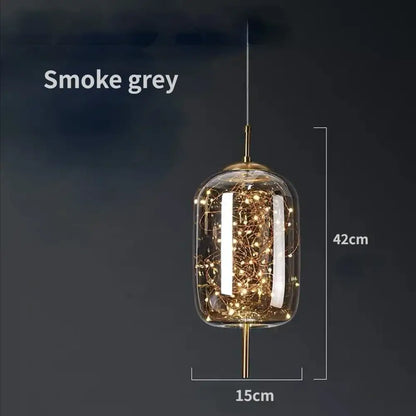 Modern brass glass pendant light featuring smoke grey glass pendant light with golden filament strings for bedroom use