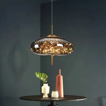 Modern brass glass pendant light featuring a translucent dome and warm glowing string lights for bedroom use