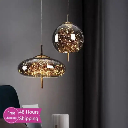 Two modern glass pendant lights with brass fixtures and golden filament strings for bedroom LED chandelier use