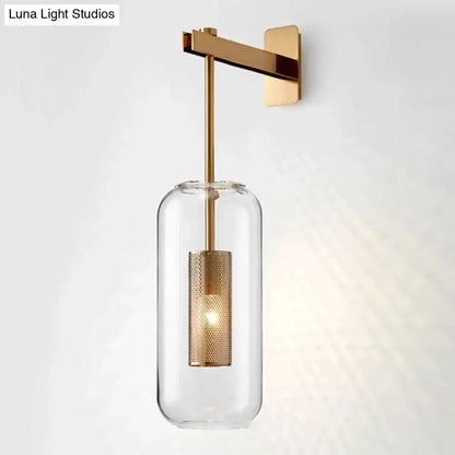 Modern brass glass wall sconce with gold-toned wire mesh guard and clear cylinder housing 110v-120v use