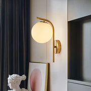 Modern brass bedside lamp with gold-toned inch fixture and frosted glass globe for bedroom lighting