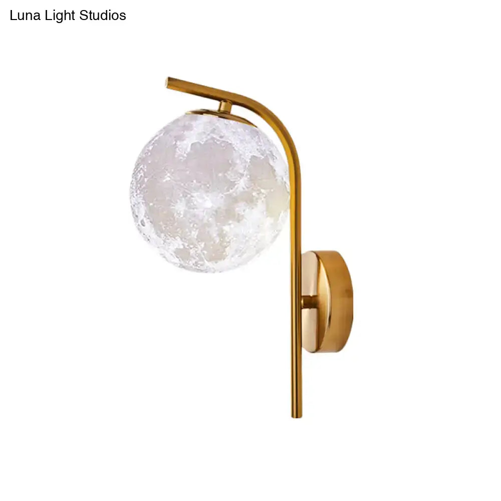 Modern brass bedside lamp with gold-toned inch fixture and frosted moon-textured glass globe for bedroom use