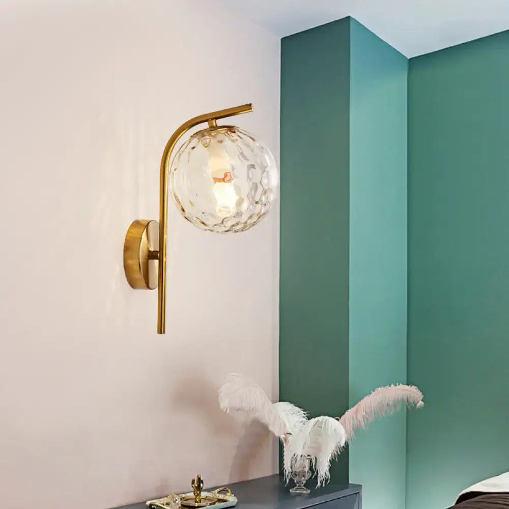 Modern brass bedside lamp with gold-toned inch fixture and clear faceted glass globe for bedroom lighting