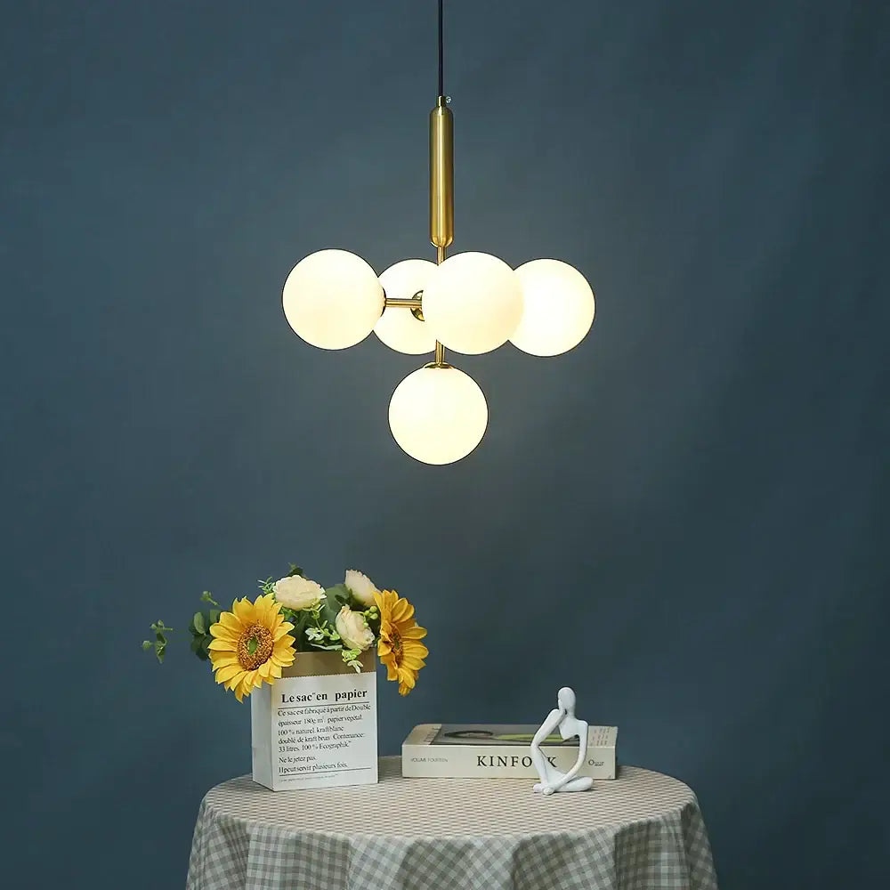 Modern brass finished ceiling light with five frosted glass globe bulbs cluster for dining room decorbites golden glass balls