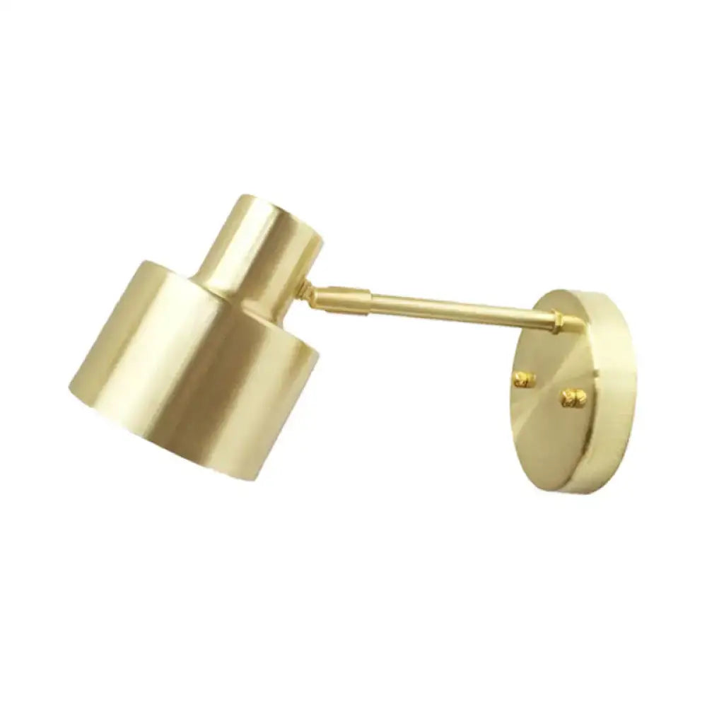 Gold-finished brass wall light with adjustable arm and cylindrical grenade shade for head corridor wall use
