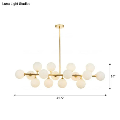 Gold-toned contemporary brass island chandelier with 16 frosted glass globes for elegant brass island lighting fixture
