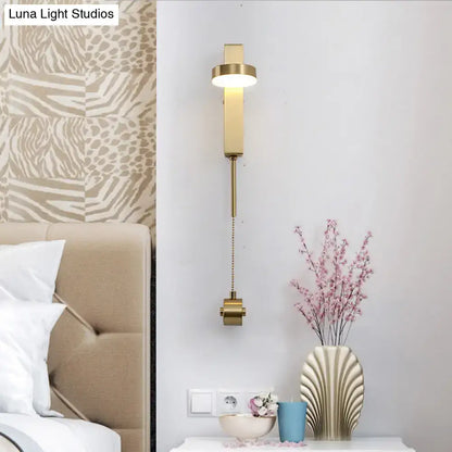 Modern brass l-shaped wall sconce with gold finish and adjustable pull chain for living room lighting