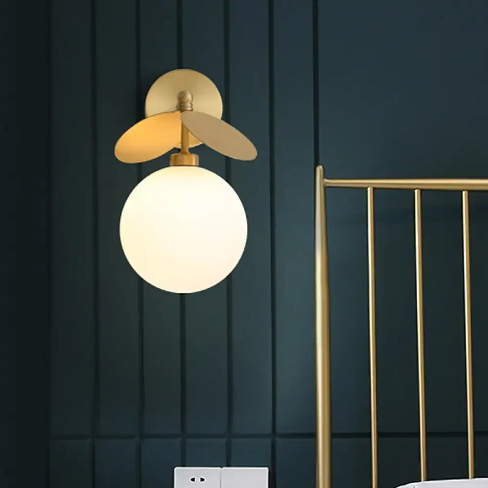 Modern brass leaf wall lamp with cream glass spherical shade and gold-toned metal accents for 220v-240v or 110v-120v use