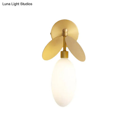 Modern brass leaf wall lamp with cream glass globe and gold-toned metal fins suitable for 220v-240v and 110v-120v use