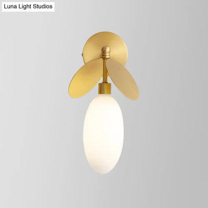 Modern brass leaf wall lamp with cream glass shade and gold-toned 220v-240v wall sconce featuring petal accents