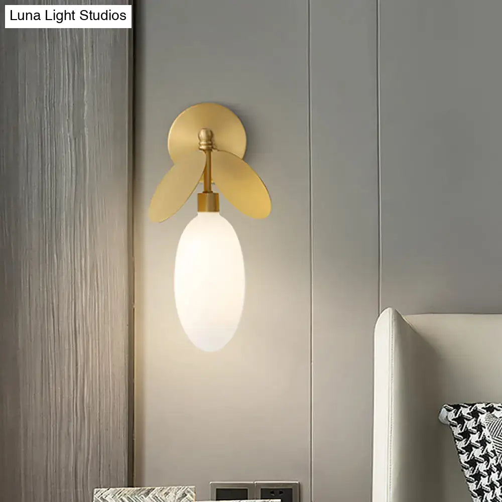 Modern brass leaf wall lamp with cream glass shade and gold-toned metal arms designed for 220v-240v and 110v-120v use