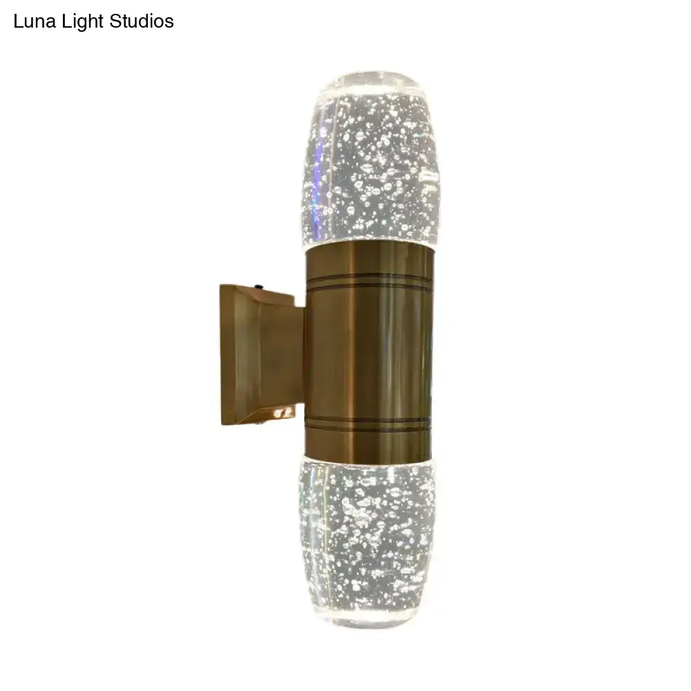 Modern brass led crystal wall sconce light featuring a clear glass bubble-effect design with bronze metallic band