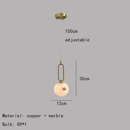 Minimalist brass led pendant light with copper frame and off-white marble globe featuring gold leaf decorbites brass led